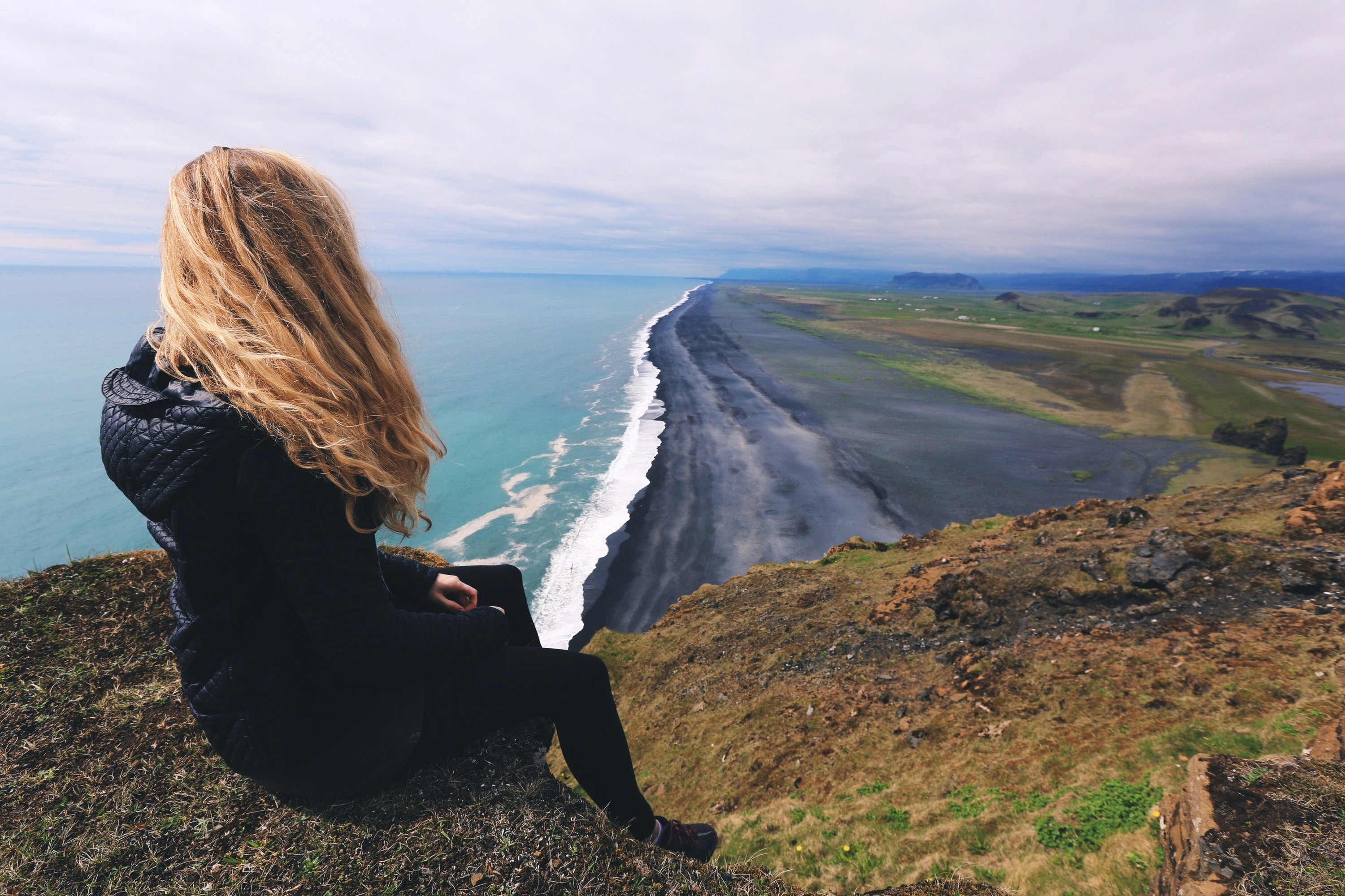 woman looking at seashore